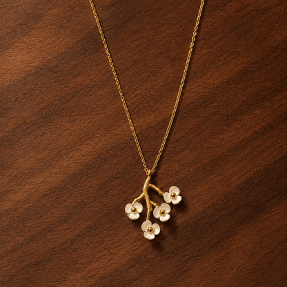 Collier Floraison Maison Eluna - bijou renaissance maternité - branche cerisier acier doré fleurs résine blanche